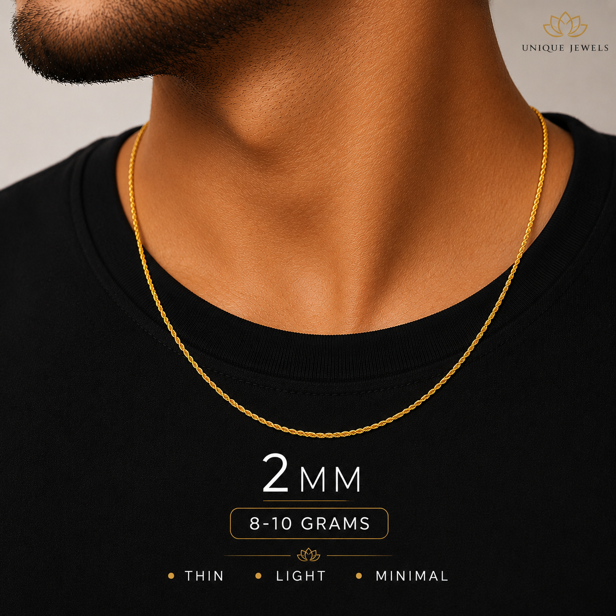 A close-up of a man's neck and chest wearing a thin gold chain necklace. The image includes text overlays stating '2 MM', '8-10 GRAMS', and 'THIN • LIGHT • MINIMAL', with a 'UNIQUE JEWELS' logo in the top right corner.