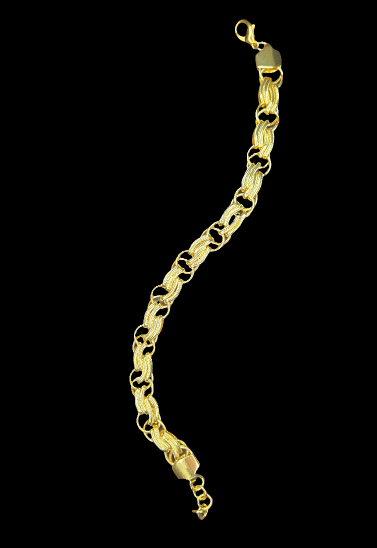 Gold bracelet on a black background