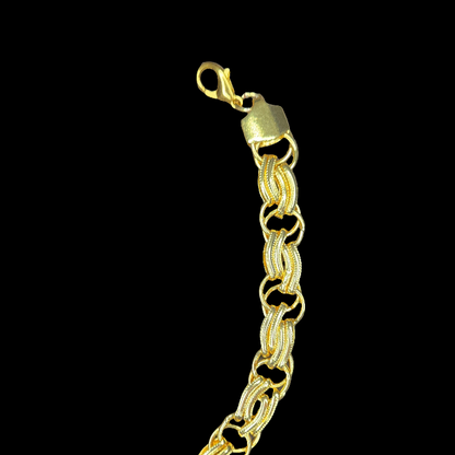 Gold bracelet on a black background